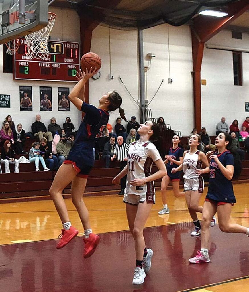 Hoops tourney honors teacher